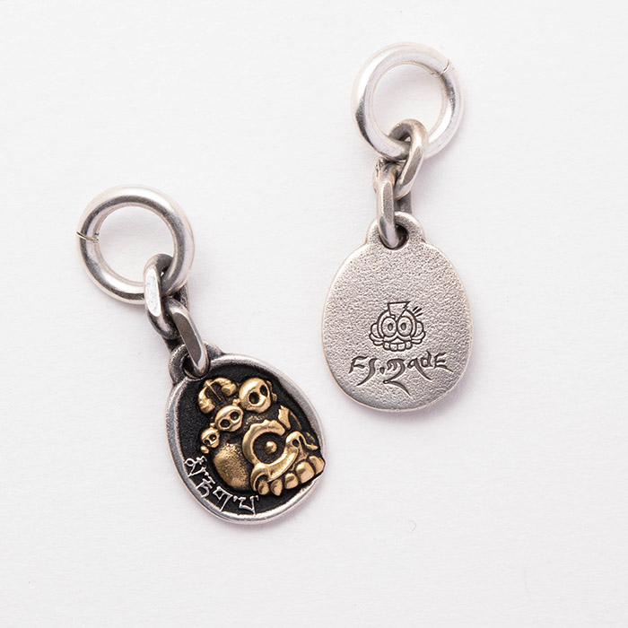 「微笑むドクロ」チャーム · 彫金版 / 36000円